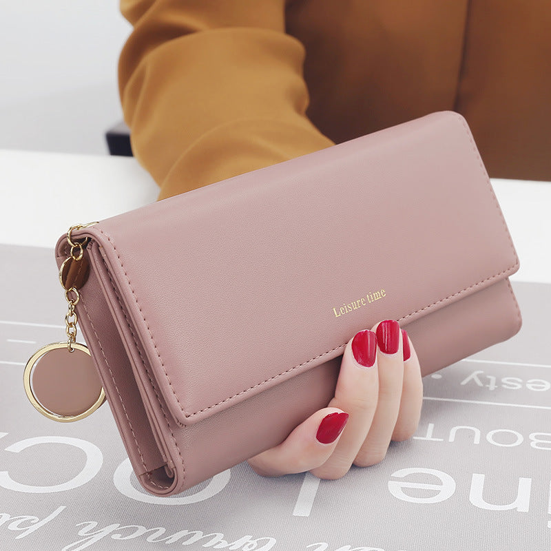 Women's hand holding wallet female long section 2020 new Japanese and Korean personality pendant multi-function student wallet